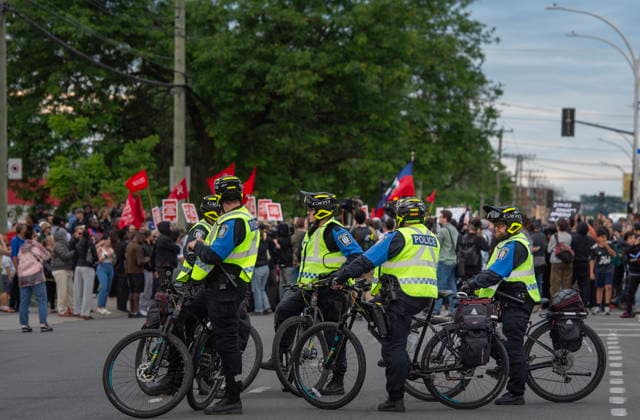 June 15, 2026, Montreal, Pq, Canada: Police watch over Anti police brutality protesters outside Montreal police station 39 in Montreal North during an anti police brutality protest on Monday June 15, 2026. Montreal Canada  - ZUMAc35_ 20260615_zaf_c35_134 Copyright: xPeterxMccabex