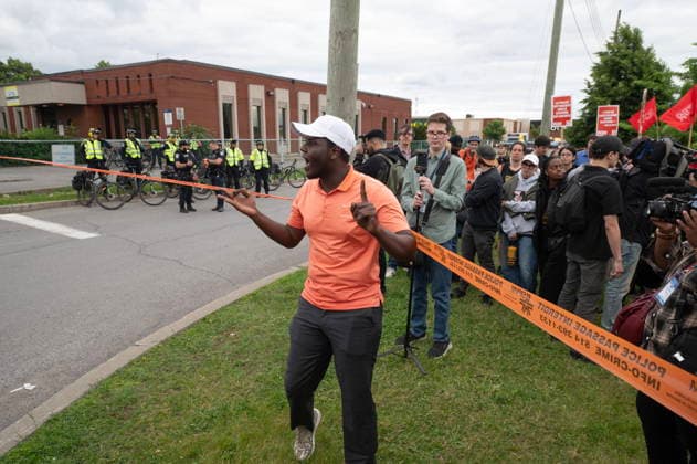June 15, 2026, Montreal, Pq, Canada: A protester rallies others outside Montreal police station 39 in Montreal North during an anti police brutality protest on Monday June 15, 2026. Montreal Canada  - ZUMAc35_ 20260615_zaf_c35_137 Copyright: xPeterxMccabex
