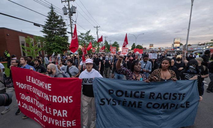 June 15, 2026, Montreal, Pq, Canada: Anti police brutality protesters march outside Montreal police station 39 in Montreal North during an anti police brutality protest on Monday June 15, 2026. Montreal Canada  - ZUMAc35_ 20260615_zaf_c35_139 Copyright: xPeterxMccabex