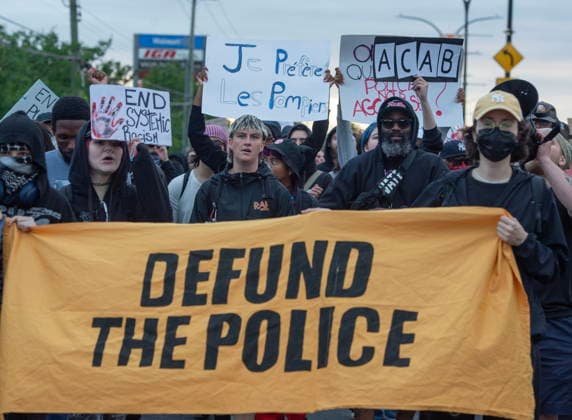 June 15, 2026, Montreal, Pq, Canada: Anti police brutality protesters march outside Montreal police station 39 in Montreal North during an anti police brutality protest on Monday June 15, 2026. Montreal Canada  - ZUMAc35_ 20260615_zaf_c35_141 Copyright: xPeterxMccabex