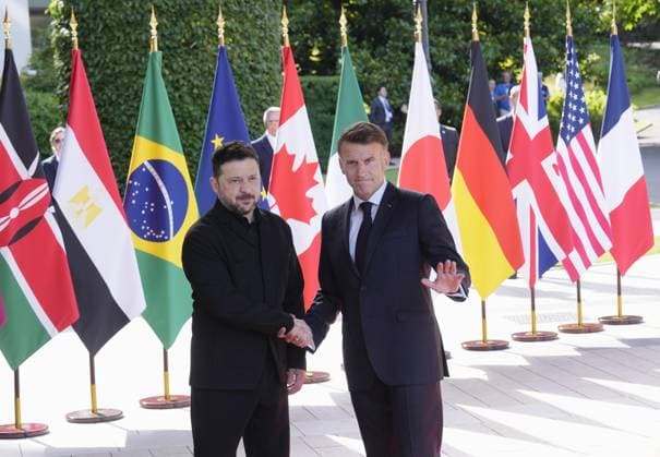 G7 summit in France Ukrainian President Volodymyr Zelenskyy (L) shakes hands with French President Emmanuel Macron after arriving at the venue of a Group of Seven summit in Evian-les-Bains, France, on June 16, 2026.  A14AA0005619047P
