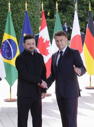 G7 summit in France Ukrainian President Volodymyr Zelenskyy (L) shakes hands with French President Emmanuel Macron after arriving at the venue of a Group of Seven summit in Evian-les-Bains, France, on June 16, 2026.  A14AA0005619048P