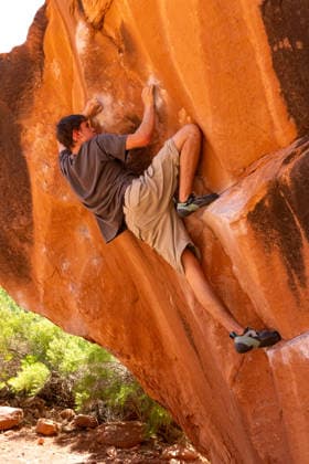A young male climber bouldering on the Chaos Boulder, Big Bend Bouldering Area near Moab, Utah. Moab Big Bend Bouldering Area Utah United States Copyright: xJonxG.xFullerx xVWPicsx 3964-JGF-climbing-Bouldering-US-UT