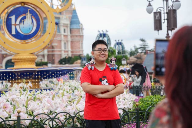 SHANGHAI, CHINA - JUNE 16: Tourists pose for photos with a floral display themed for the 10th anniversary on June 16, 2026 in Shanghai, China. Shanghai Disney Resort has welcomed over 100 million visitors since its opening.  Copyright: xVCGx 111648625140
