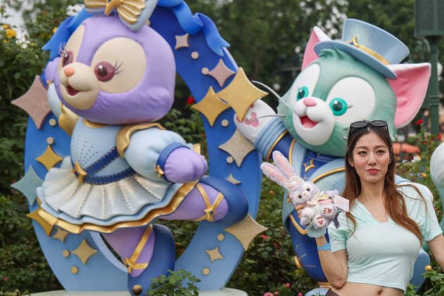 SHANGHAI, CHINA - JUNE 16: Visitors pose for photos with a sculpture marking the 10th anniversary of Shanghai Disney Resort on June 16, 2026 in Shanghai, China. The theme park has received over 100 million visits since its opening.  Copyright: xVCGx 111648625141