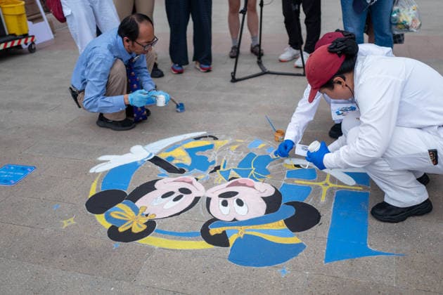 SHANGHAI, CHINA - JUNE 16: Staff members paint a mural to celebrate the 10th anniversary on June 16, 2026 in Shanghai, China. Shanghai Disney Resort has received over 100 million visits since its opening.  Copyright: xVCGx 111648625106