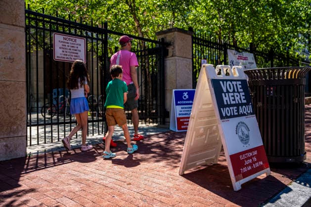 People arrive to vote in Washington DC s 2026 primary elections at Stuart Hobson Middle School in Washington, DC on Tuesday, June 16, 2026. The two front-runners to succeed current DC Mayor Muriel Bowser are Kenyan McDuffie, a moderate with support from many of Bowser s cabinet, and Janeese Lewis George, democratic socialist who built her campaign around organized labor.  WAP20260616302 BONNIExCASH