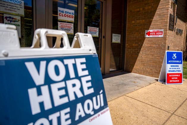 Vote Here signs are seen outside Sherwood Recreation Center as people vote in Washington DC s 2026 primary elections on Tuesday, June 16, 2026. The two front-runners to succeed current DC Mayor Muriel Bowser are Kenyan McDuffie, a moderate with support from many of Bowser s cabinet, and Janeese Lewis George, democratic socialist who built her campaign around organized labor.  WAP20260616311 BONNIExCASH