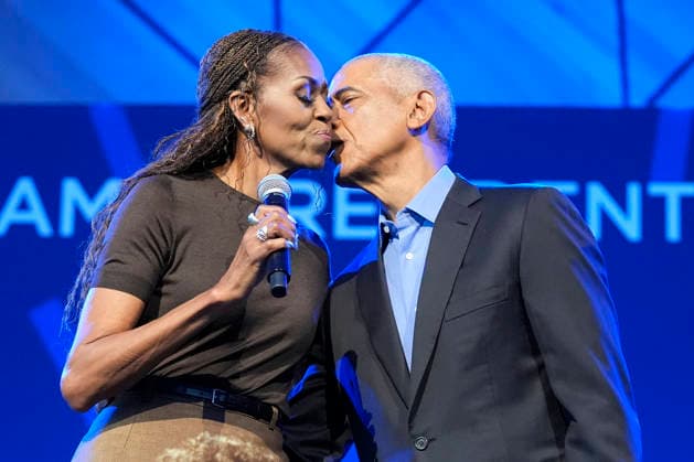 Former President Barack Obama kisses former first lady Michelle Obama at a stakeholders event at the Obama Presidential Center, Tuesday, June 16, 2026, in Chicago, Illinois. The Obama Library officially opens to the public on Friday June 19, 2026. Pool  CHI2026061601 PabloxMartinezxMonsivais