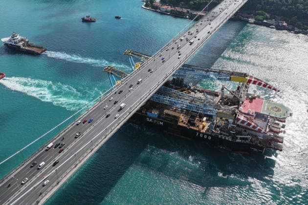 World s 3rd-largest semi-submersible crane vessel transits Bosphorus Strait ISTANBUL, TURKIYE - JUNE 17: An aerial view of the Saipem 7000, the world s third-largest semi-submersible crane vessel used in natural gas pipeline construction, as it transits the Bosphorus near the Fatih Sultan Mehmet Bridge during its voyage from Libya to Romania in Istanbul, Turkiye, on June 17, 2026. Cemal Yurttas Anadolu Istanbul Turkey. Editorial use only. Please get in touch for any other usage.  Copyright: x2026xAnadoluxCemalxYurttasx