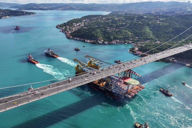 World s 3rd-largest semi-submersible crane vessel transits Bosphorus Strait ISTANBUL, TURKIYE - JUNE 17: An aerial view of the Saipem 7000, the world s third-largest semi-submersible crane vessel used in natural gas pipeline construction, as it transits the Bosphorus near the Fatih Sultan Mehmet Bridge during its voyage from Libya to Romania in Istanbul, Turkiye, on June 17, 2026. Cemal Yurttas Anadolu Istanbul Turkey. Editorial use only. Please get in touch for any other usage.  Copyright: x2026xAnadoluxCemalxYurttasx