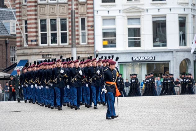 Amsterdam The Netherlands 17th June 2026 State visit of Emperor Naruhito of Japan. Impressions around the Dam around the Koninklijke Paleis Military march on to the Dam. Burgundy berets with a black feather. landmacht, luchtmobile, brigade,