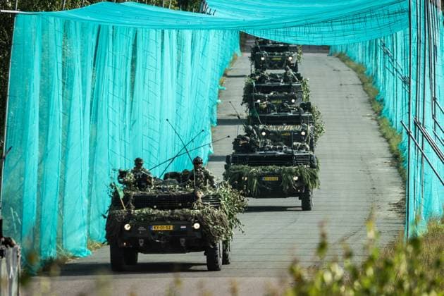 LOHHEIDE - A combat unit with Fennek armored vehicles drives through a corridor protected by anti-drone nets during the military exercise Fighter Lion at a training ground in Germany. The largest army exercise of 2026 focuses on defending the Netherlands and NATO territory in a changing security situation. VINCENT JANNINK netherlands out - belgium out  Copyright: xx x561245011x originalFilename: 561245011.jpg