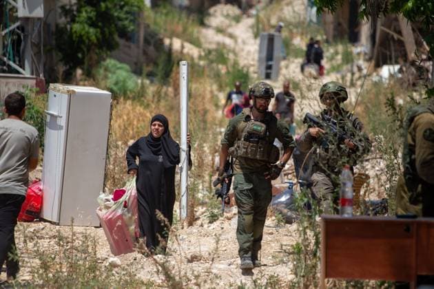 Displaced Families Granted Brief Access to Retrieve Belongings from Tulkarm Camp TULKARM REFUGEE CAMP, WEST BANK JUNE 17, 2026: Palestinian residents carry personal belongings after Israeli authorities allowed 45 families to enter Tulkarm refugee camp for a limited period to retrieve items from their homes. The visit comes amid the ongoing Israeli military operation in Tulkarm and Nur Shams refugee camps, which has displaced large numbers of residents and caused significant damage to homes and infrastructure. Photo by Mojahid Nawahda JNA Press. (Photo by Mojahid Nwahda JNA Press via Nexpher Images) TULKARM