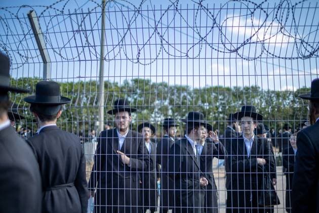 Ultra-Orthodox Jews opposing compulsory military service protest outside an Israeli prison KFAR YONA, ISRAEL - JUNE 17: Thousands of demonstrators gather outside the Beit Lid military prison, calling for the release of an Ultra-Orthodox youth who was arrested for refusing compulsory military service in Kfar Yona, Israel on June 17, 2026. Israeli forces took extensive security measures around the prison during the protest. photo by Roman Levin JNA Press (Photo by Roman Levin JNA Press via Nexpher Images) Kfar Yona