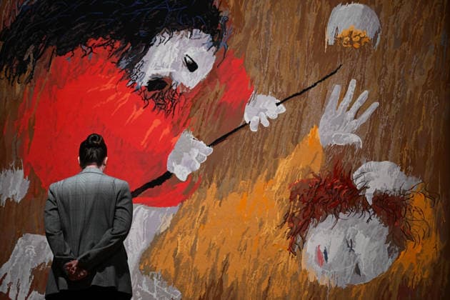 ARTHUR BOYD TAPESTRIES EXHIBITION, A guest takes a look at tapestries during a media preview of a major winter exhibition ˜Arthur Boyd: Tapestries™ at the National Gallery of Australia in Canberra, Thursday, June 18, 2026. At 2.5 by 3.4 metres, each tapestry features a scene from the life of St Francis of Assisi, one of the most venerated figures in history. ( NO ARCHIVING CANBERRA AUSTRALIAN CAPITAL TERRITORY AUSTRALIA  Copyright: xLUKASxCOCHx 20260618135301073541