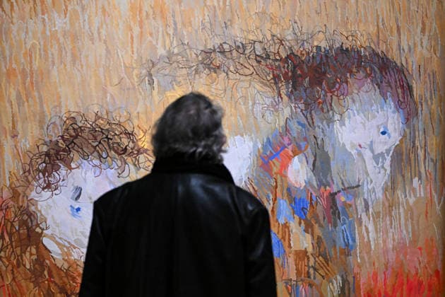 ARTHUR BOYD TAPESTRIES EXHIBITION, A guest takes a look at a tapestry during a media preview of a major winter exhibition ˜Arthur Boyd: Tapestries™ at the National Gallery of Australia in Canberra, Thursday, June 18, 2026. At 2.5 by 3.4 metres, each tapestry features a scene from the life of St Francis of Assisi, one of the most venerated figures in history. ( NO ARCHIVING CANBERRA AUSTRALIAN CAPITAL TERRITORY AUSTRALIA  Copyright: xLUKASxCOCHx 20260618186895692660
