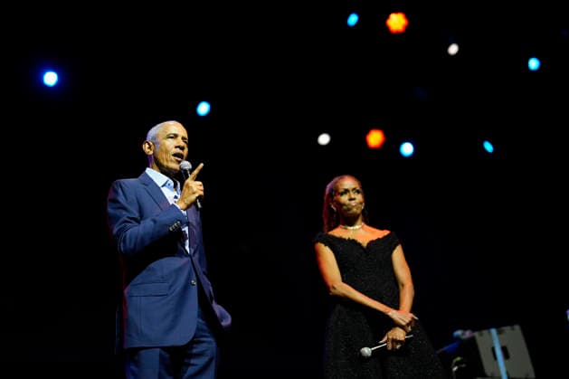 Former President Barack Obama and former first lady Michelle Obama appear on stage as they surprised administration and campaign alumni in Chicago ahead of the dedication ceremony of the Obama Presidential Center, Wednesday, June 17, 2026. Pool  CHX20260617214 PabloxMartinezxMonsivais