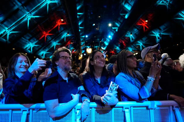 People listen to former President Barack Obama and former first lady Michelle Obama as they speak on stage as they surprised administration and campaign alumni in Chicago ahead of the dedication ceremony of the Obama Presidential Center, Wednesday, June 17, 2026. Pool  CHX20260617219 PabloxMartinezxMonsivais