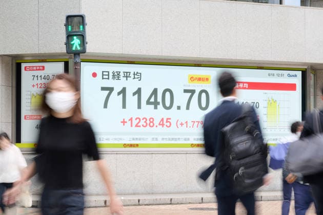A picture shows the Nikkei Stock Average displayed on an electronic board in Tokyo, Japan, on June 18, 2026. The Nikkei Stock Average rose above 71,000 on Thursday for the first time ever.  aflo_334859481