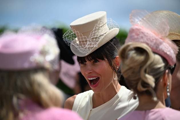 Royal Ascot 2026 BERKSHIRE, UNITED KINGDOM - JUNE 18: Visitors wearing elaborate hats and elegant outfits attend the third day of the traditional Royal Ascot horse racing event, held in the United Kingdom since 1711, at Ascot Racecourse in Berkshire, United Kingdom on June 18, 2026. Rasid Necati Aslim Anadolu Berkshire United Kingdom. Editorial use only. Please get in touch for any other usage.  Copyright: x2026xAnadoluxRasidxNecatixAslimx