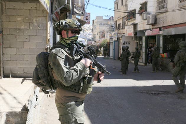 June 18, 2026, Nablus, West Bank, Palestine: Israeli soldiers are positioned in the center of the market during a raid on Balata refugee camp east of Nablus in the West Bank. Israeli forces raided the central market during a security operation. Palestinian sources said that the army arrested seven Palestinians from various neighborhoods in Nablus and its surrounding refugee camps. Nablus Palestine - ZUMAs197 20260618_aaa_s197_012 Copyright: xNasserxishatyehx