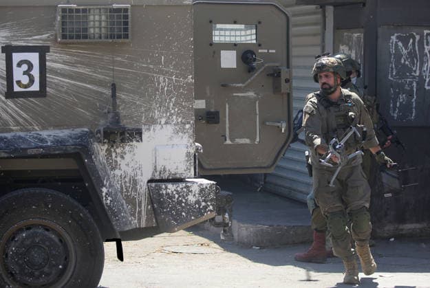 June 18, 2026, Nablus, West Bank, Palestine: An Israeli soldier carries a drone at the entrance to the market during a raid on Balata refugee camp east of Nablus in the West Bank. Israeli forces raided the central market during a security operation. Palestinian sources said that the army arrested seven Palestinians from various neighborhoods in Nablus and its surrounding refugee camps. Nablus Palestine - ZUMAs197 20260618_aaa_s197_013 Copyright: xNasserxishatyehx