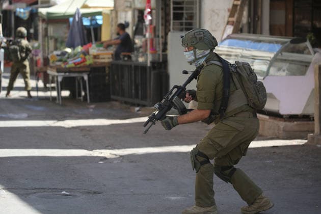 June 18, 2026, Nablus, West Bank, Palestine: Israeli soldiers are positioned in the center of the market during a raid on Balata refugee camp east of Nablus in the West Bank. Israeli forces raided the central market during a security operation. Palestinian sources said that the army arrested seven Palestinians from various neighborhoods in Nablus and its surrounding refugee camps. Nablus Palestine - ZUMAs197 20260618_aaa_s197_017 Copyright: xNasserxishatyehx