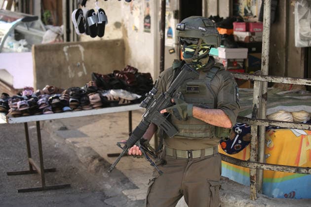 June 18, 2026, Nablus, West Bank, Palestine: Israeli soldiers are positioned in the center of the market during a raid on Balata refugee camp east of Nablus in the West Bank. Israeli forces raided the central market during a security operation. Palestinian sources said that the army arrested seven Palestinians from various neighborhoods in Nablus and its surrounding refugee camps. Nablus Palestine - ZUMAs197 20260618_aaa_s197_016 Copyright: xNasserxishatyehx