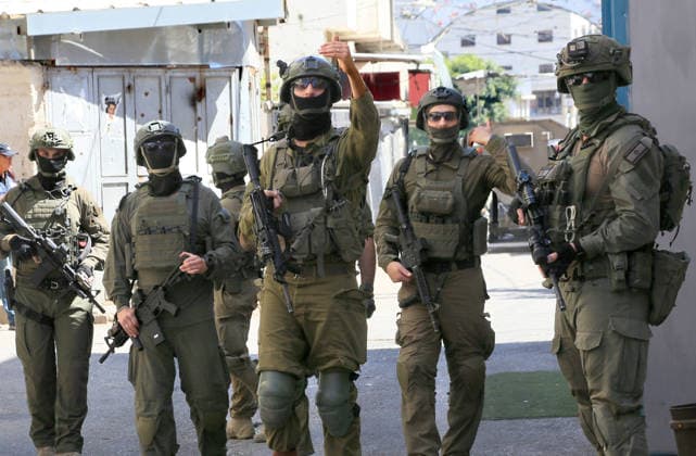 June 18, 2026, Nablus, West Bank, Palestine: Israeli soldiers are stationed in the center of the market during a raid on Balata refugee camp east of Nablus in the West Bank. Israeli forces raided the central market during a security operation. Palestinian sources said that the army arrested seven Palestinians from various neighborhoods in Nablus and its surrounding refugee camps. Nablus Palestine - ZUMAs197 20260618_aaa_s197_009 Copyright: xNasserxishatyehx