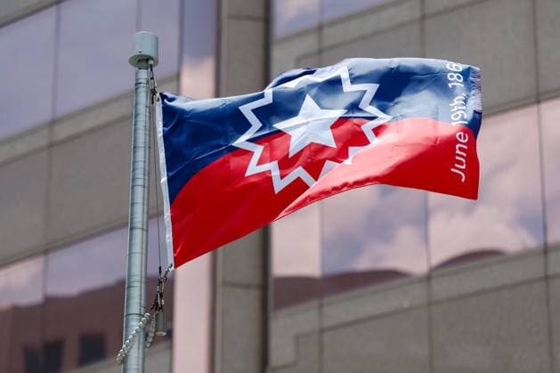 June 18, 2026, Tampa, Florida, USA: The Juneteenth flag waves, after it is raised by Hillsborough County Commissioner Gwen Myers during the annual Juneteenth Flag-Raising ceremony outside the Fred B. Karl County Center on Thursday, June 18, 2026, in Tampa. Tampa USA - ZUMAs70_ 20260618_zan_s70_016 Copyright: xJeffereexWoox