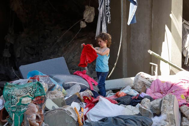 June 18, 2026, Nabatieh District, South Lebanon, lebanon: A family from the town of Kfarreman stands amid the ruins of their destroyed home, sifting through the rubble in search of personal belongings, clothes, and essential items. The scene reflects the heavy toll of recent destruction, as residents attempt to salvage what remains of their daily lives amid widespread damage. Nabatieh District lebanon  - ZUMAb339 20260618_znp_b339_002 Copyright: xAbdulxKaderxAlxBayx