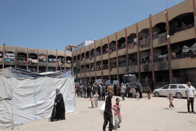 Jabalia Gaza Strip Displacement Crisis Displaced Palestinians walk among tents set up in the courtyard of the Al-Faluja School shelter in Jabalia, in the northern Gaza Strip, on June 18, 2026. Thousands of displaced families in northern Gaza rely on humanitarian assistance as shortages of food, water and basic supplies persist amid the continuing conflict and humanitarian crisis. Gaza Gaza Strip Palestinian Territories Copyright: xAhmedxAlxArinix