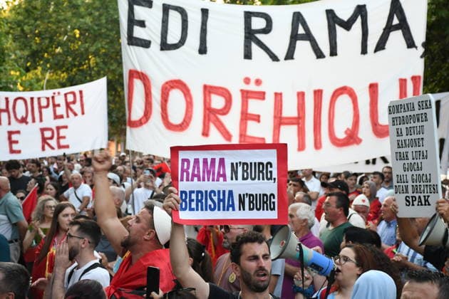 Anti-tourism project protests continue for 19th day in Albania TIRANA, ALBANIA - JUNE 18: Protests against a planned tourism project in the Zvernec area of the coastal city of Vlora continue for a 19th consecutive day in Tirana, Albania on June 18, 2026. Demonstrators gathered in Skanderbeg Square under the slogan Albania is not for sale, with a large number of participants joining the rally. Protesters opposed the reported sale of a beach in Zvernec as part of a tourism project allegedly linked to Ivanka Trump and Jared Kushner. Carrying banners, placards, and Albanian flags, demonstrators marched along the Boulevard of the Martyrs of the Nation toward the Prime Minister’s Office. Olsi Shehu Anadolu Tirana Albania. Editorial use only.  Copyright: x2026xAnadoluxOlsixShehux