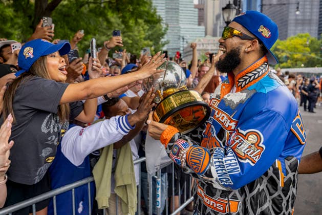 New York Knicks Championship Ticker Tape Parade Karl-Anthony Towns of the New York Knicks greets fans during the New York Knicks Championship ticker tape parade and victory rally celebrating winning the 2026 NBA Finals. The New York Knicks defeated the San Antonio Spurs in five games to win their first NBA Championship in 53 years. New York City New York United States Copyright: MichaelxNigro