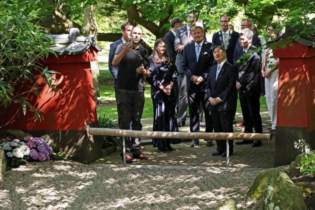 Japan s emperor in Leiden Emperor Naruhito (front, R) of Japan visits the Japanese garden at the Hortus botanicus of Leiden University with King Willem-Alexander (back, C) of the Netherlands in Leiden, the Netherlands, on June 18, 2026, during his state visit. (Pool photo)  A14AA0005619459P