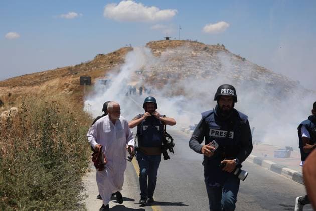 Israeli Forces Disperse Protest During Friday Prayers in Dura DURA, WEST BANK JUNE 19, 2026: Palestinians perform Friday prayers in protest against the seizure of Jabal Tarousa and the establishment of a settlement outpost in the town of Dura, south of Hebron. Israeli forces dispersed the gathering by firing tear gas canisters, causing several Palestinians, including journalists, to suffer from tear gas inhalation. Photo by Mosab Shawer JNA Press. (Photo by Mosab shawer JNA Press via Nexpher Images) DURA