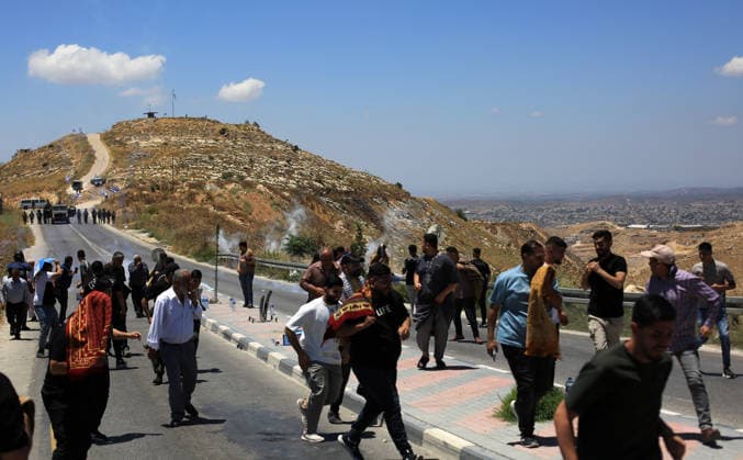 Palestinians protest planned settlement expansion in Hebron HEBRON, WEST BANK - JULY 19: Palestinians protest plans for a new settlement project announced by Israeli Finance Minister Bezalel Smotrich in the town of Dura, south of Hebron, West Bank, Palestine on June 19, 2026. Demonstrators gathered in the Jabal Tarusa area to oppose the planned settlement expansion. Israeli forces intervened using stun grenades and tear gas, prompting some protesters to leave the area. Mamoun Wazwaz Anadolu Hebron West Bank. Editorial use only. Please get in touch for any other usage.  Copyright: x2026xAnadoluxMamounxWazwazx
