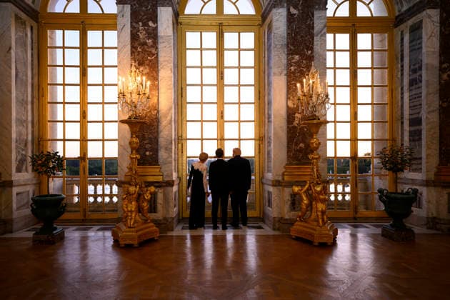 June 19, 2026, Versalles, France: U.S. President Donald Trump, right, French President Emmanuel Macron, center, and Brigitte Macron view the sunset from the Palace of Versailles June 17, 2026, in Versailles, France. Versalles France - ZUMAp138 20260619_zaa_p138_006 Copyright: xDanielxTorok WhitexHousex
