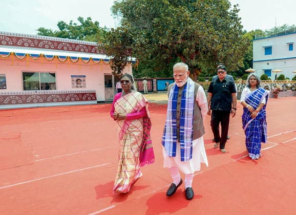 RECORD DATE NOT STATED President Droupadi Murmu with Prime Minister Narendra Modi arrives at a Skill Centre during their visit to Pahadpur village, in Mayurbhanj Mayurbhanj Odisha , Jun 20 (ANI): President Droupadi Murmu with Prime Minister Narendra Modi arrives at a Skill Centre during their visit to Pahadpur village, in Mayurbhanj on Saturday. (@narendramodi X ANI Photo) Mayurbhanj Odisha India Copyright: xANIx ANI_20260620255