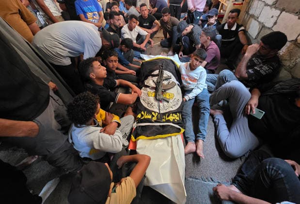 Mourners attend funeral of Islamic Jihad commander in Khan Younis Mourners carry the body of Zaki Abu Mustafa, a commander in the Al-Quds Brigades, the armed wing of Islamic Jihad, during his funeral in Khan Younis, southern Gaza Strip, on June 20, 2026. Abu Mustafa was killed in an Israeli drone strike that targeted tents sheltering displaced Palestinians in the al-Mawasi area, west of Khan Younis, on the previous evening. Photo by Tariq Mohammad APA Images Khan Yunis Gaza Strip Palestinian Territory 200626_Khan_Yunis_TM_01(3) Copyright: xapaimagesxTariqxMohammad xapaimagesx