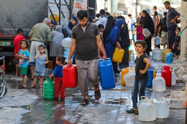 Residents Struggle to Access Drinking Water in Nuseirat Camp NUSEIRAT REFUGEE CAMP, CENTRAL GAZA STRIP JUNE 2026: Residents of Nuseirat refugee camp face increasing difficulties in obtaining drinking water and municipal water supplies amid ongoing shortages. Families dig makeshift pits in an effort to collect limited amounts of water to meet their daily needs. The scarcity of water continues to affect thousands of residents across the camp. NUSEIRAT, GAZA STRIP Palestine, State of Copyright: x xRamzixAbuxAmerx xJNAxPressx