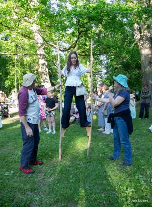 June 19, 2026, Helsinki, Uusimaa, Finland: HELSINKI, FINLAND Ã¢â‚¬ June 19, 2026: A visitor tries walking on traditional wooden stilts during the annual Seurasaari Midsummer Bonfires (Juhannusvalkeat) at Seurasaari Open-Air Museum in Helsinki, Finland. Traditional outdoor games and activities are part of the Finnish Midsummer celebration, offering visitors the opportunity to experience customs and family-friendly traditions associated with the country s summer solstice festivities. Helsinki Finland - ZUMAt172 20260619_zip_t172_045 Copyright: xJosexTabaresx