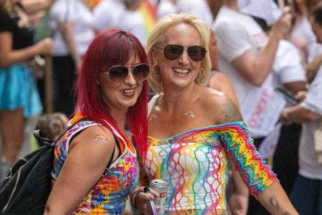 June 20, 2026, Essex, United Kingdom: Two women wearing colourful rainbow-print outfits and sunglasses smile together during the Essex Pride. Essex Pride is a celebration of lesbian, gay, bisexual and transgender life in Essex and beyond, led by Cheryl Hole, also known as Cheryl the Queen. Essex United Kingdom - ZUMAs197 20260620_aaa_s197_107 Copyright: xIanxDavidsonx