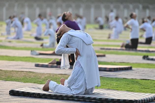 GURUGRAM, INDIA - JUNE 20: People perform yoga during the Yoga Protocol rehearsal ahead of the 12th International Day of Yoga at Tau Devi Lal Stadium, sector-38 near Rajiv Chowk, on June 20, 2026 in Gurugram, India. (Photo by Parveen Kumar Hindustan Times ) Yoga Protocol Rehearsal Ahead Of 12th International Day Of Yoga At Tau Devi Lal Stadium