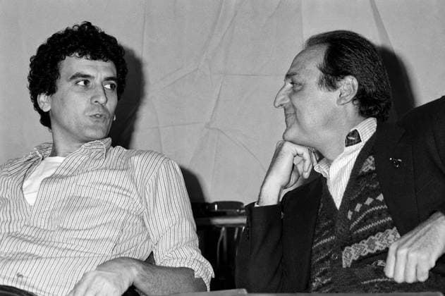 Massimo Troisi ROME, ITALY - DECEMBER 2: The actor and director Massimo Troisi with showman, Renzo Arbore, during meets the students in the main lecture theatre at La Sapienza University on December 2, 1982 in Rome, Italy. Rome Lazio Italy Copyright: xStefanoxMontesix