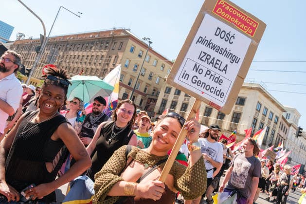 June 20, 2026, Warsaw, Masovian Voivodeship, Poland: A person carries a sign that reads Worker Democracy - Enough of Israel s pinkwashing - No pride in genocide during Warsaw s first ever radical Pride parade. Called Equality Parade - Queer Liberation March in Polish, the grassroots march was organized by a collective of radical LGBTQ+ activists as an anti-capitalist alternative to Warsaw s traditional Pride parade, which has recently become dominated by corporate sponsors. Warsaw Poland - ZUMAk204 20260620_zip_k204_015 Copyright: xRomanxKozielx
