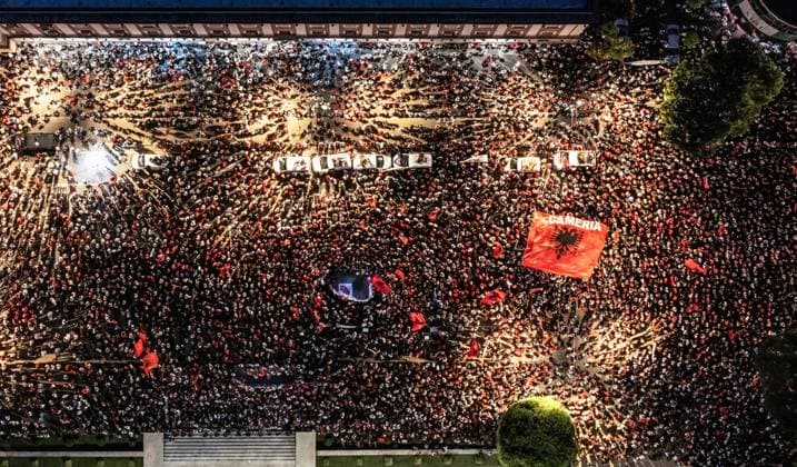 Thousands Gather in Tirana for Day 21 of Anti-Kushner Protests TIRANA, ALBANIA JUNE 20, 2026: Thousands of demonstrators gather in central Tirana during the twenty-first consecutive day of protests against a proposed luxury tourism development project linked to Jared Kushner. The rally drew one of the largest crowds since the movement began in late May, including members of the Albanian diaspora who traveled from across Europe and beyond to take part. Protesters marched through the capital carrying banners, placards, and Albanian flags while calling for the cancellation of the project and expressing concerns over its potential environmental impact on protected coastal areas. Tirana Albania Copyright: x xVlasovxSulajx xJNAxPressx