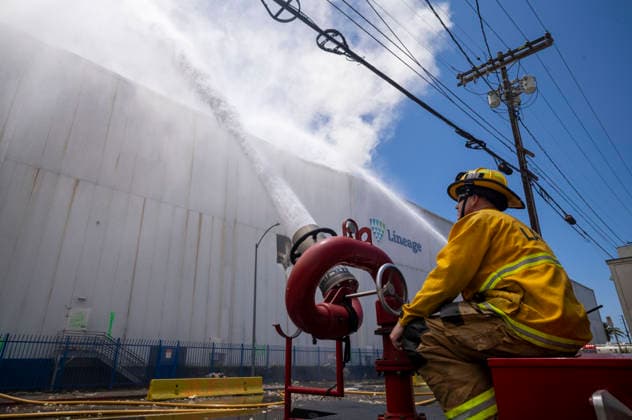 June 20, 2026, Los Angeles, California, USA: Fire crews work a warehouse fire in the Boyle Heights section of Los Angeles on Saturday , June 20, 2026. Mayor Los Angeles Mayor Karen Bass today issued a declaration of local emergency to mobilize additional resources for the city in the days ahead to address a large fire at a cold storage facility in Boyle Heights. Los Angeles USA - ZUMAc68_ 20260620_zaf_c68_003 Copyright: xRingoxChiux