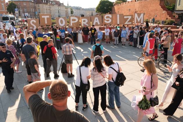 June 20, 2026, Warsaw, Masovian Voivodeship, Poland: Protesters hold up placards with letters that spell out stop racism during a demonstration on Warsaw s Castle Square for World Refugee Day. Organized under the slogan open republic, the rally was held in protest against growing xenophobia towards migrants and refugees in Poland, as well as the increasing use of anti-migrant rhetoric by Polish conservatives and far-right politicians. Warsaw Poland - ZUMAk204 20260620_zip_k204_040 Copyright: xRomanxKozielx